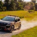 The Zooming 2025 Nissan Rogue, Brushing Dust As It Cross The Path