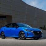 The J.D. Power IQS Winner, The 2025 Nissan Sentra, Parked Outside A Beautiful Piece Of Architecture