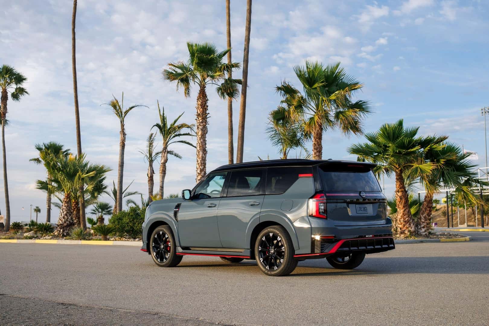 The High-Performance 2026 Nissan Armada's Back Profile, Cruising Past Palm Trees In Florida
