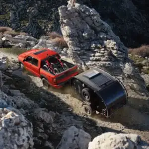 2026 Nissan Frontier PRO-4X towing a camper