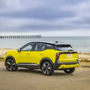 Yellow 2026 Nissan Kicks Rear Side View