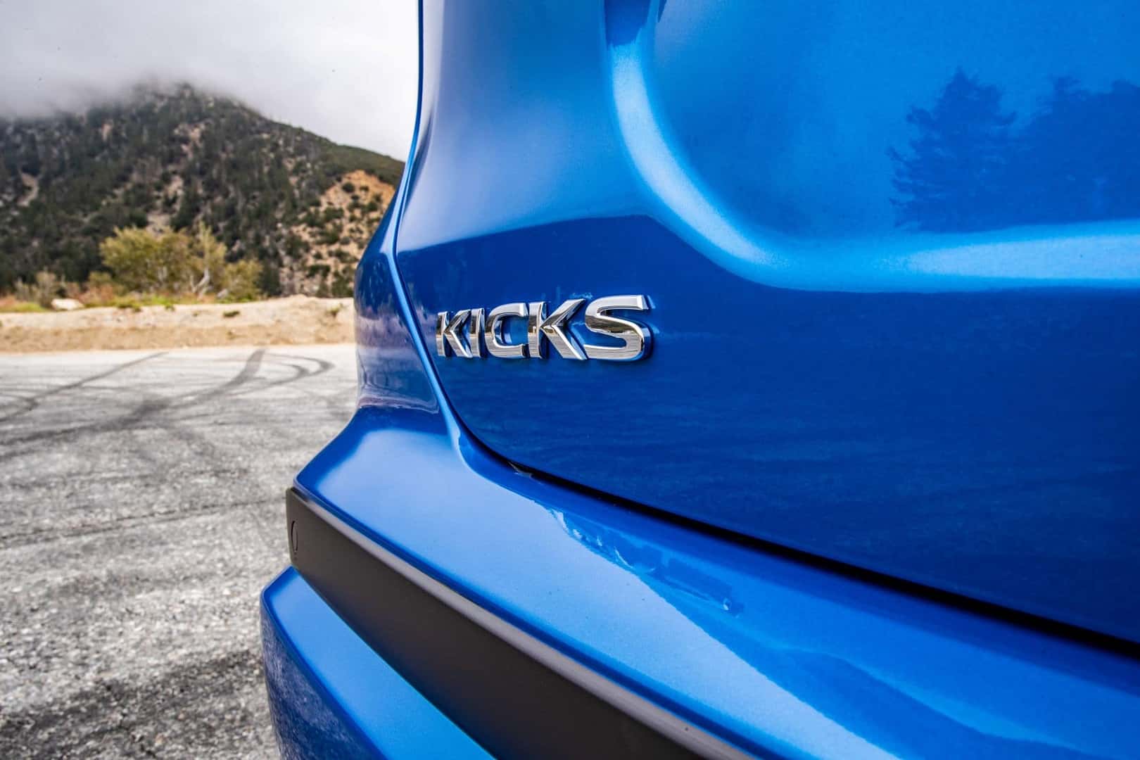 The Back Exterior Of The Smart Blue 2024 Nissan Kicks
