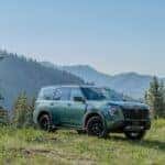 The Dazzling Nissan Armada Cruising Through A Whimsical Forest