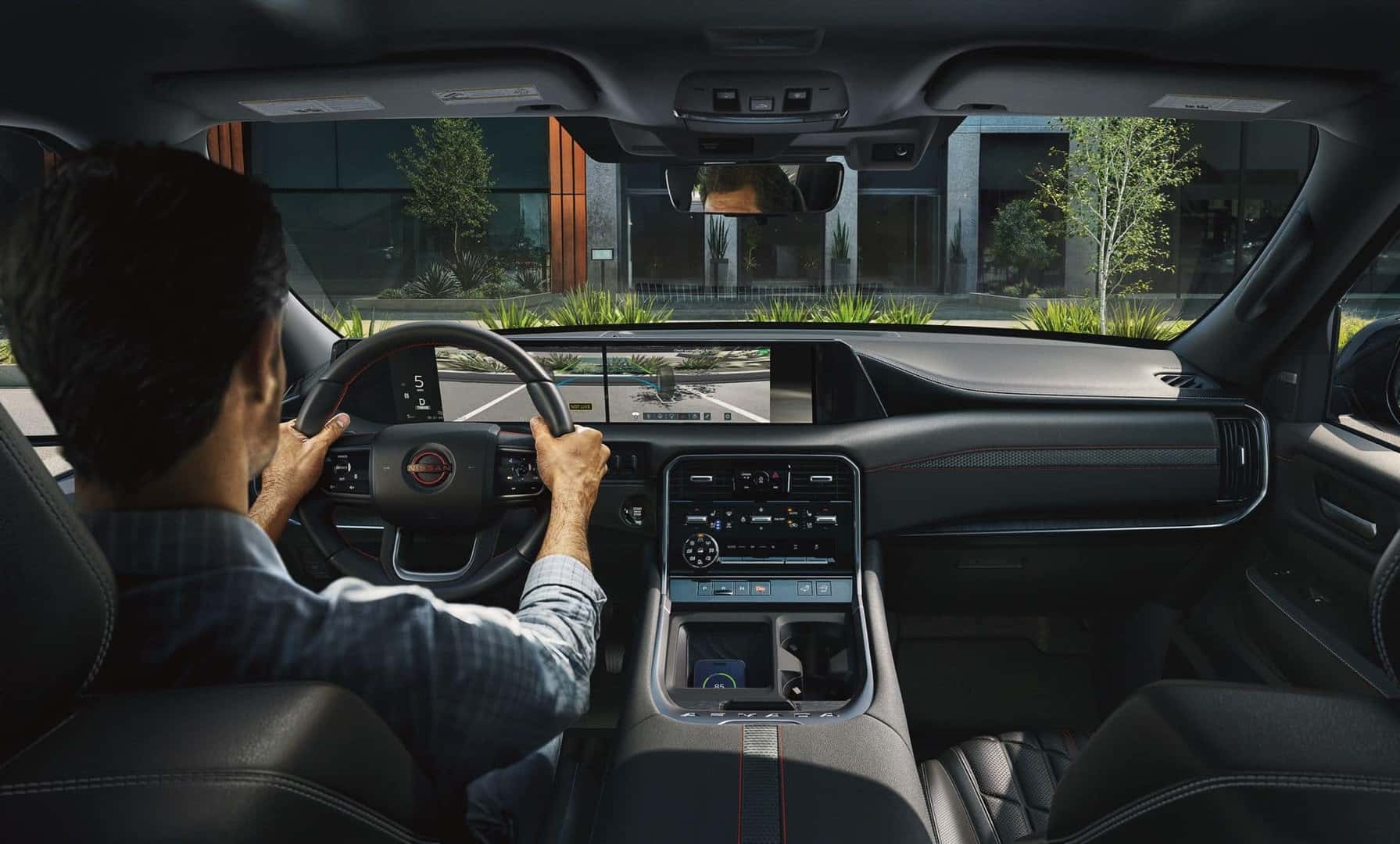 A Nissan Driver Using The Invisible Hood View Technology To Safely Park