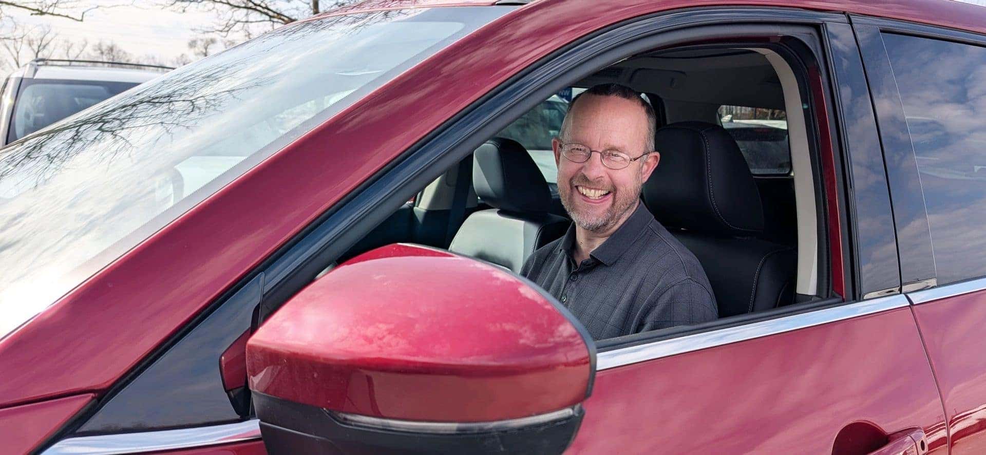 The Acclaimed Nissan Sound Engineer, Patrick Dennis, pictured Inside A Red Vehicle