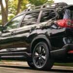 Subaru Ascent driving down a road in a neighborhood