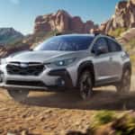 Subaru Crosstrek driving on a dirt road