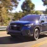 Subaru Ascent driving down a road