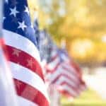 Closeup of an American flag in a row