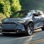 2023 Subaru Solterra driving down a road