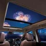Interior of a sunroof with fireworks in the sky