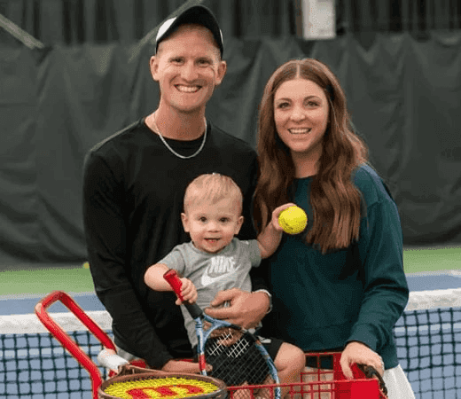 Family with Baby on Tennis Court