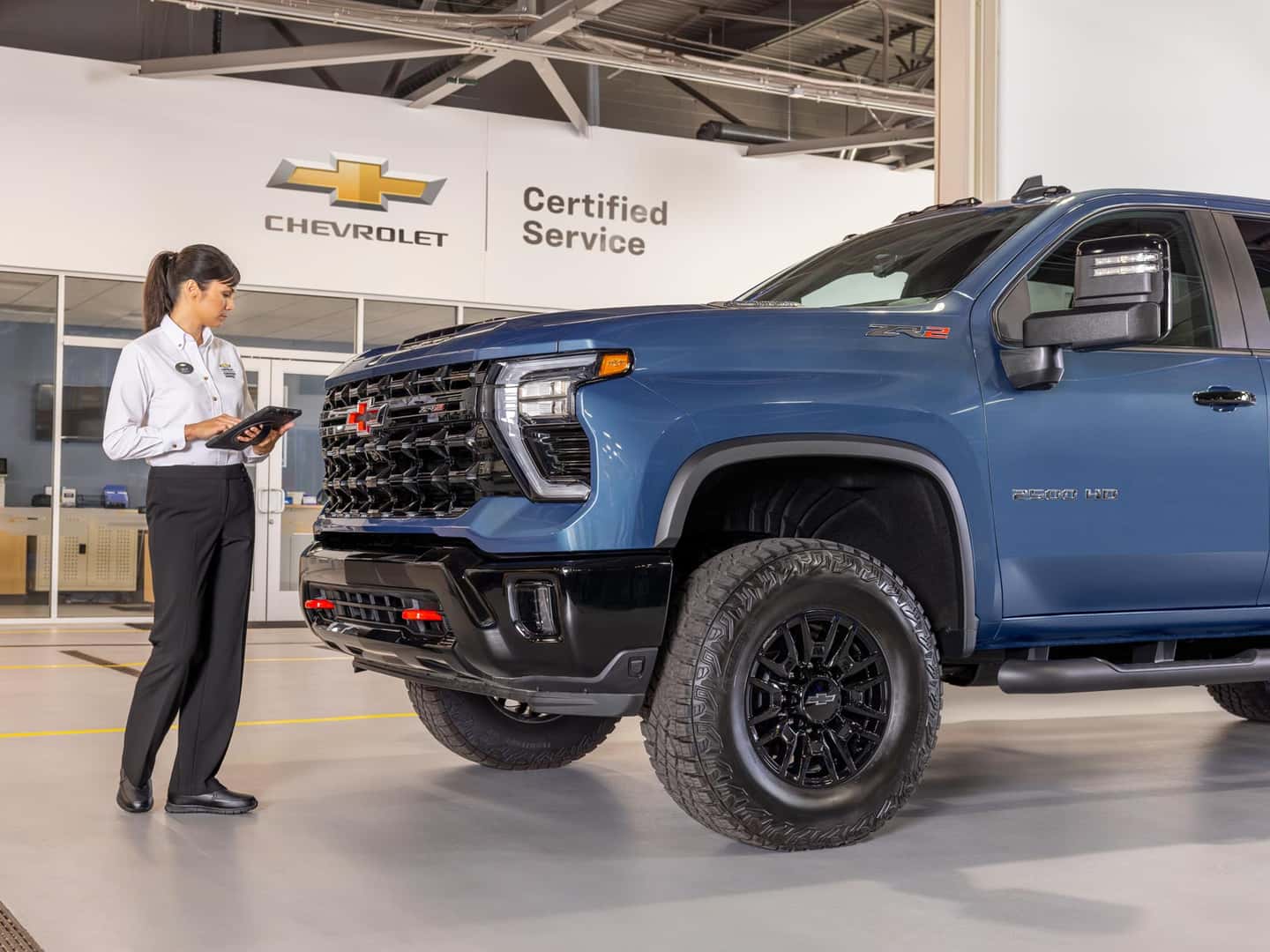 GM-trained technician servicing a commercial Chevrolet at Elk Grove Chevrolet