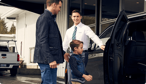 Family looking at car