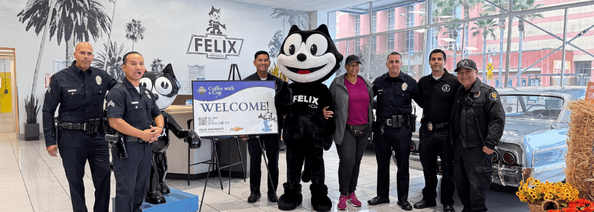 Felix the Cat with local law enforcement and community members at a Coffee with a Cop event at Felix Chevrolet