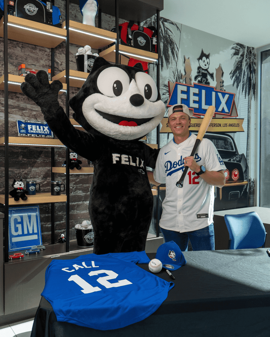 Felix the Cat with a Los Angeles Dodgers player during an appearance at Felix Chevrolet