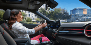 girl in driver's seat of a Chevy