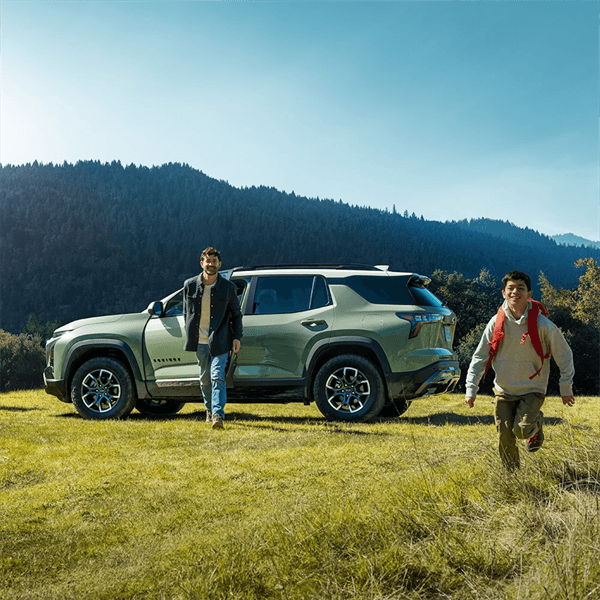 family in front of 2026 Chevy Equinox