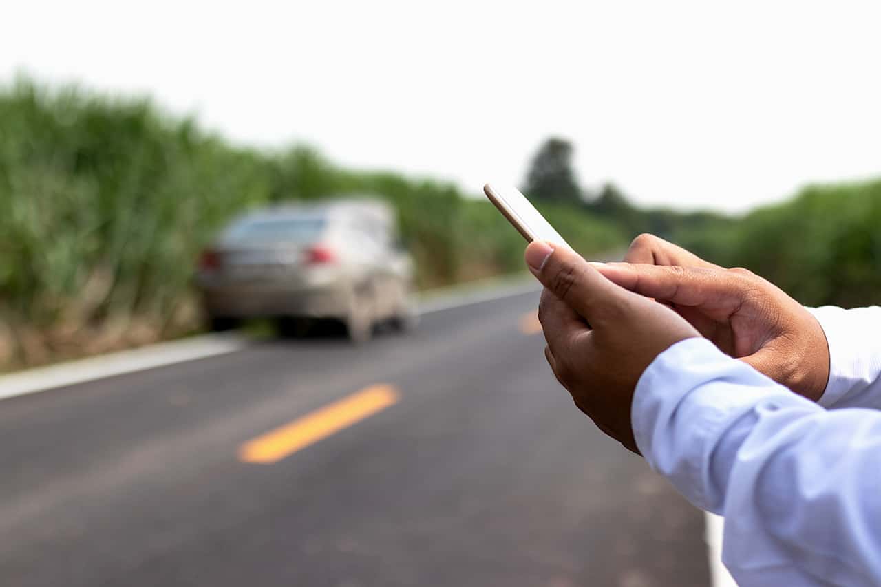 Businessman calling for assistance with his car broken. car insurance concept.