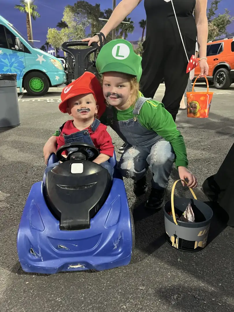 Kids trick-or-treating between decorated trunks at Findlay Honda Henderson