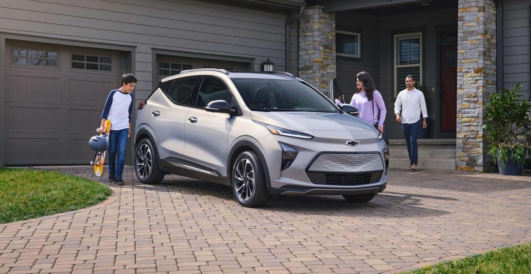 2023 Chevy Bolt EUV with family around it