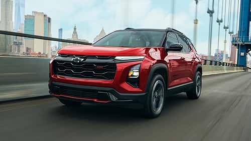 Red 2027 Chevy Equinox Driving on a Bridge