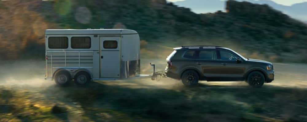 A 2025 Kia Telluride towing a trailer.