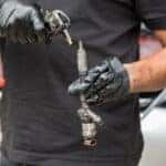 Racine, WI service technician cleaning a fuel injector