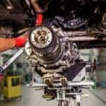 Mechanic performing automatic transmission repair in a professional auto service center in Racine, WI