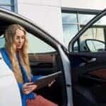 A Racine Volkswagen Driver checking their service report after servicing their volkswagen vehicle