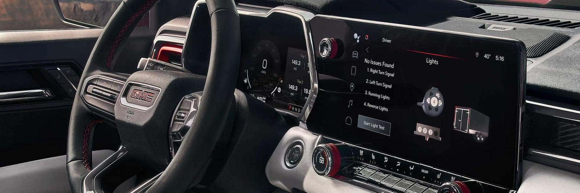 2025 GMC Canyon interior showcasing its infotainment touchscreen.