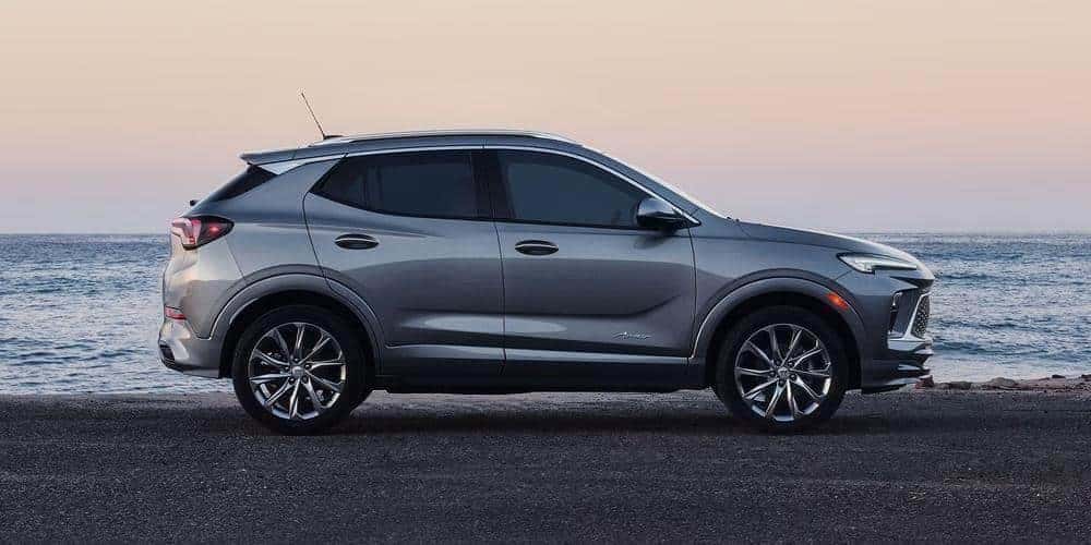 2026 Buick Encore GX driving on a scenic road.