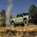A Chevrolet Silverado 1500 driving on top of a rocky hill