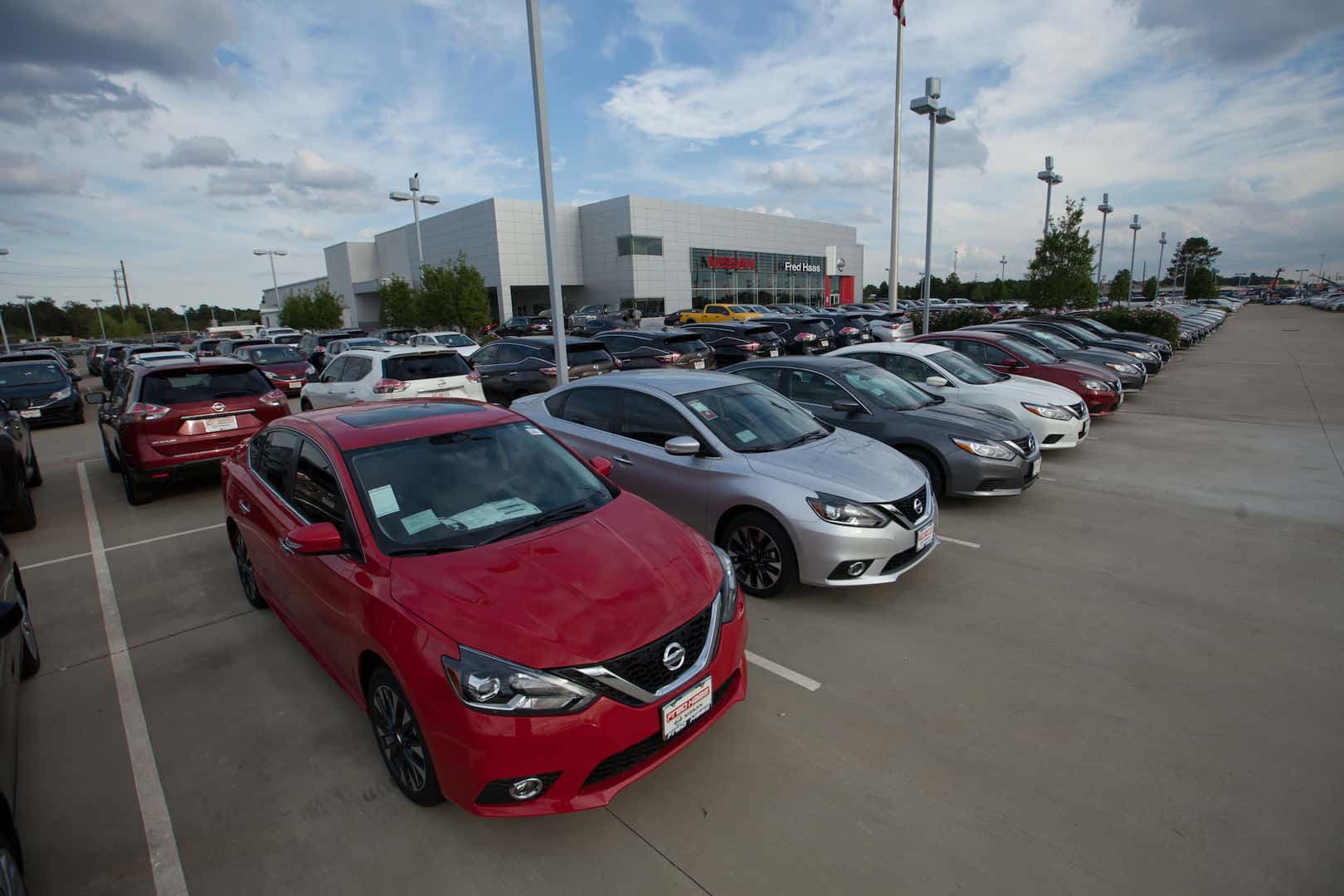 White Nissan Altima, red Nissan Rogue, blue Nissan Maxima