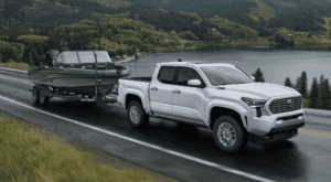 New 2025 Toyota Tacoma with a boat in tow in Houston, TX
