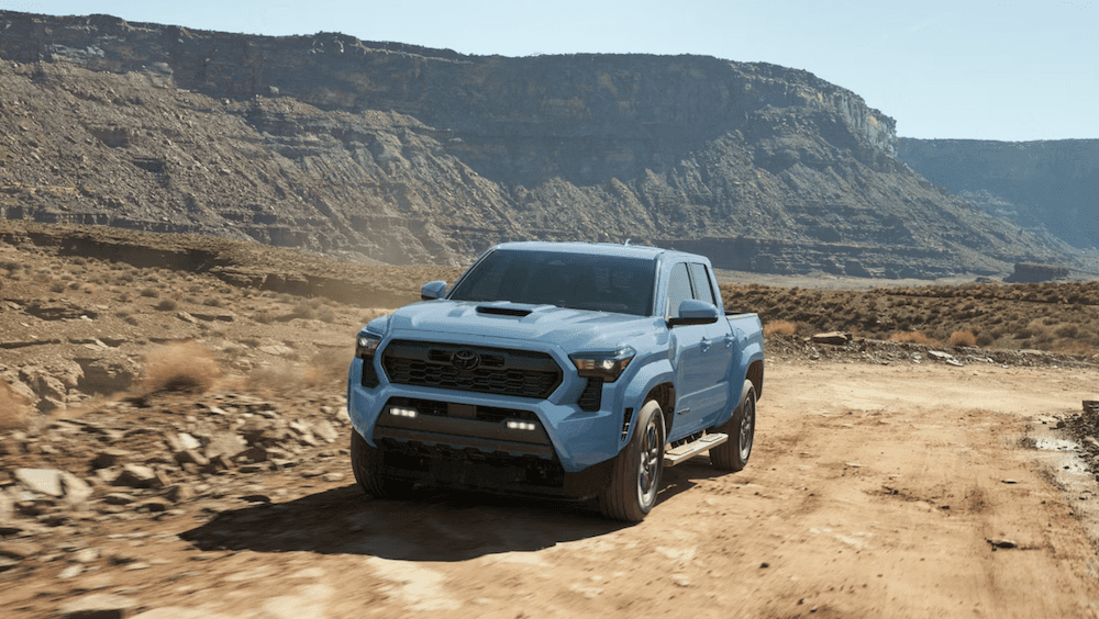 2026 Toyota Tacoma TRD Sport shown in Heritage Blue with available side step accessory for sale in Houston, TX