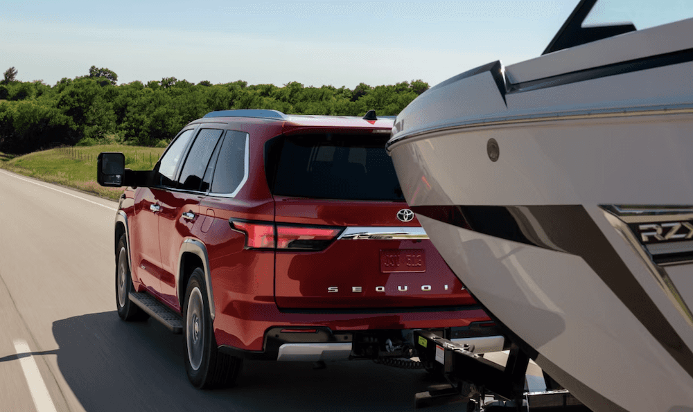 Red 2026 Toyota Sequoia towing boat Near Conroe, TX