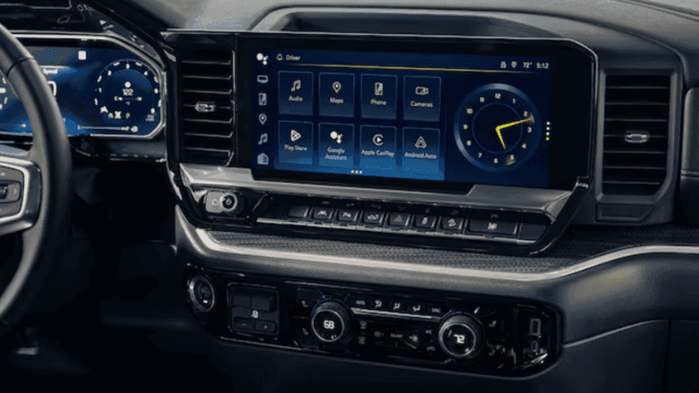 Interior dashboard of a 2026 Chevrolet Silverado featuring a wide touchscreen display, digital gauges, and modern center controls