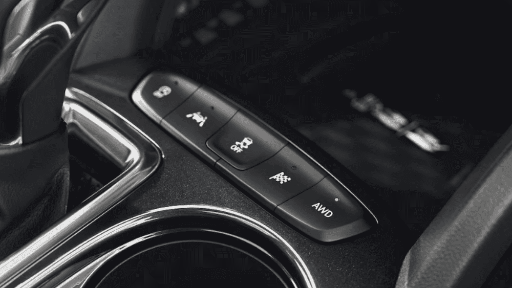 Close-up of drive mode and AWD control buttons in a 2026 Chevrolet Trailblazer center console