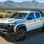 Exterior three-quarter view of a 2026 Chevrolet Colorado in a rugged landscape, showcasing winter-ready performance for work and daily commutes in Ruth, NC