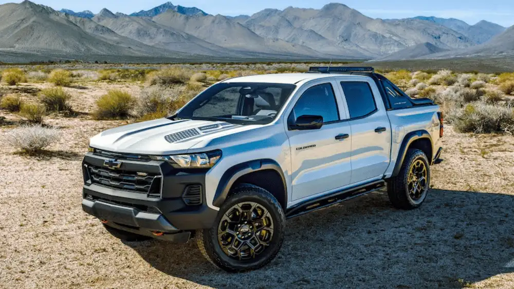 Exterior three-quarter view of a 2026 Chevrolet Colorado in a rugged landscape, showcasing winter-ready performance for work and daily commutes in Ruth, NC