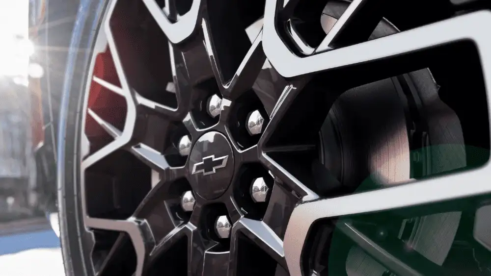 Close-up of a 2026 Chevrolet Blazer alloy wheel and brake assembly, highlighting sporty design details near Ruth, NC