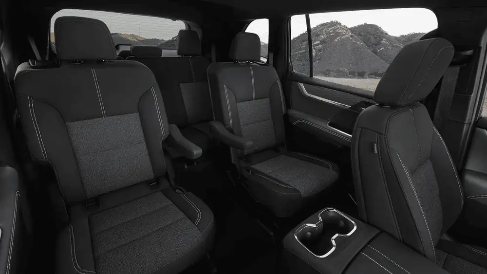 Second-row seating in a 2026 GMC Acadia showing spacious captain’s chairs and flexible interior space for families near Ruth, NC
