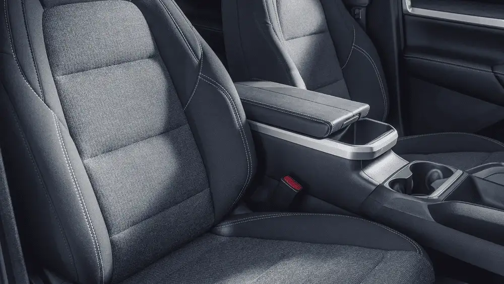 Front seating area of a 2026 GMC Terrain featuring comfortable cloth seats, center console storage, and a spacious cabin near Ruth, NC