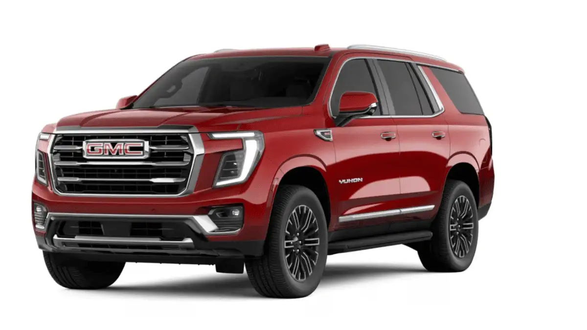 Big SUV battle featuring the 2026 GMC Yukon XL around Ruth NC in deep crimson red with chrome GMC grille lettering, LED headlights, Yukon XL badging, and split-spoke alloy wheels on white studio background