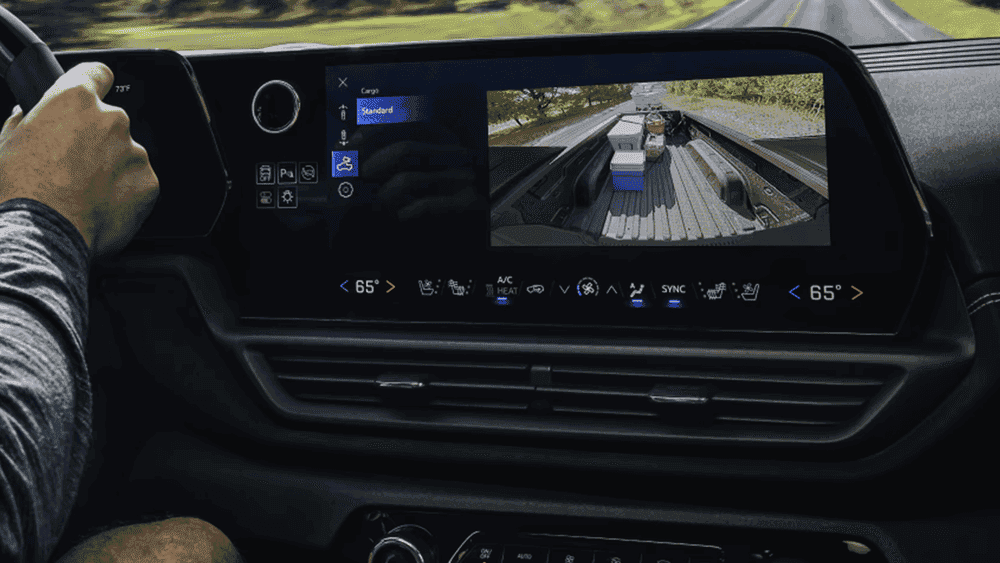 2026 Chevrolet Silverado EV infotainment screen near Ruth NC displaying cargo camera view of truck bed with standard cargo mode selected and dual-zone climate controls