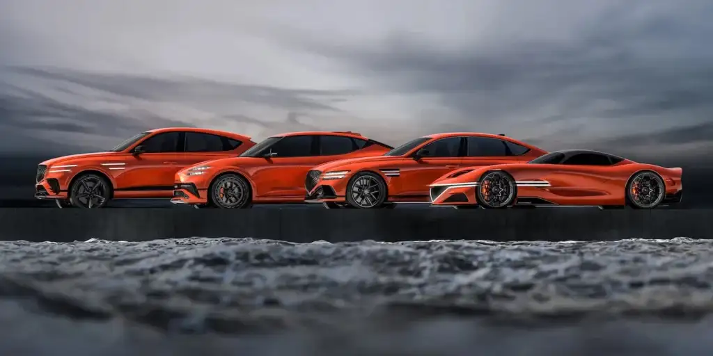 Genesis Magma lineup in orange finish showing SUV, sedan, and coupe silhouettes side by side