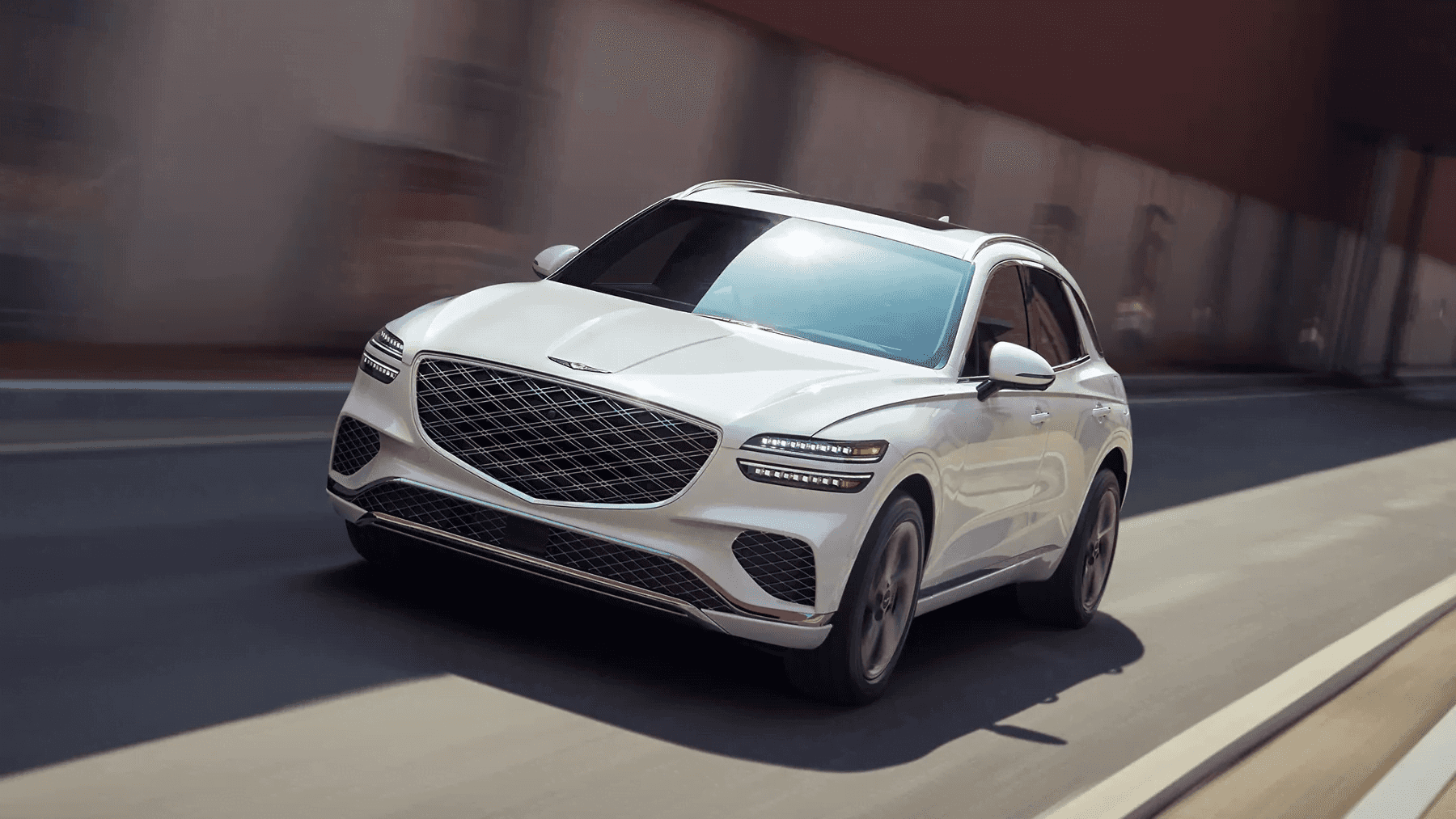 Genesis GV70 driving on road