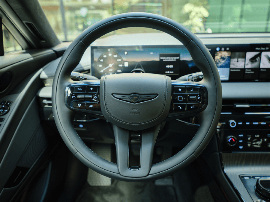 2026 Genesis G80 steering wheel and digital display.