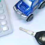 Genesis financing materials including a calculator and car key